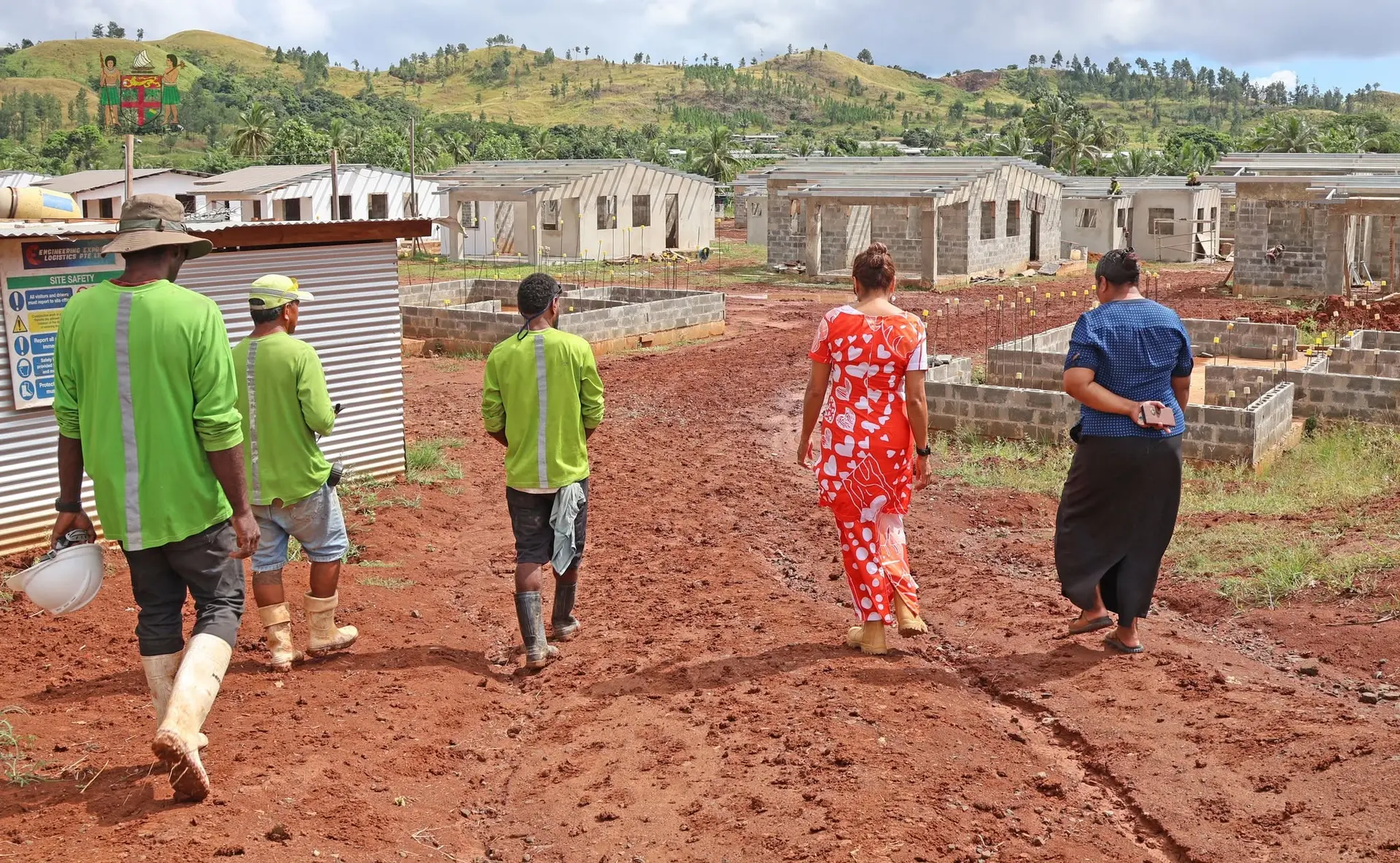 Officials scope the progress of the 37 new homes constructed under the Nabavatu Relocation Project in May. 