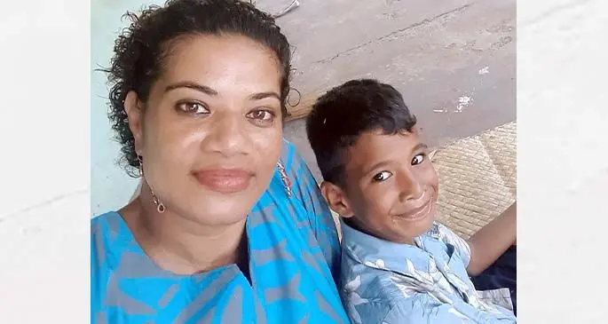 Navua Football Asssociation secretary Seni Tikoilomaloma with her son in Navua.