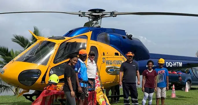 The LifeFlight Fiji team standing infront of the AS355 twin squirrel engine helicopter specially equipped for Medivac on June 6, 2020. Photo: Maraia Vula