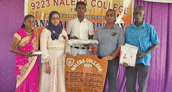 From left, Sashi Lata, Naleba College principal Sainul Nisha Ali, Dux recipient Shivinesh Anushil Prasad, vice-principal Asish Kumar and Vinesh Prasad (father) after the school prize giving ceremony on December 2, 2020.