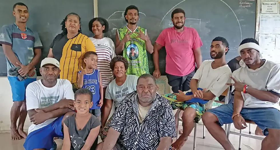Ulamila Waqavatu (Standing second from left) with other family members at the Andrews Primary School in Nadi. Photo: Mereleki Nai