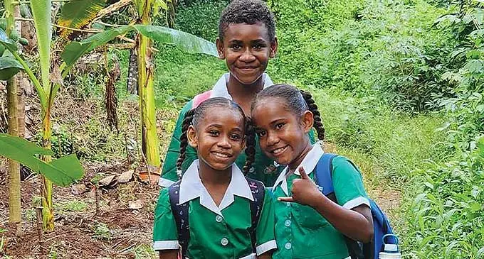 Sisilia Mereadani, Meri Ravono, and Selaima Radinibeqa on their way to first day of school on January 30, 2024.