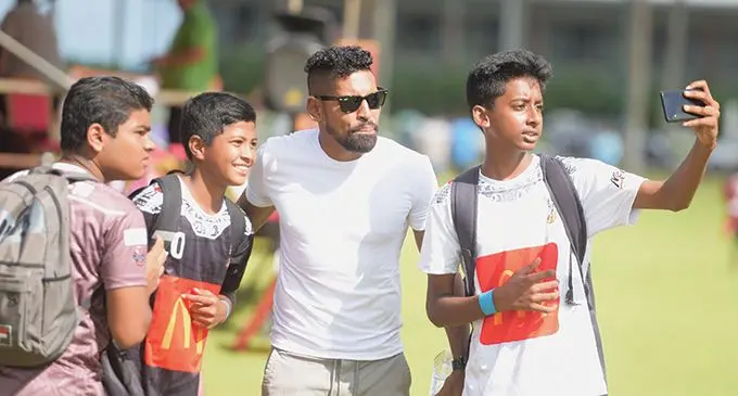 Digicel Fiji football captain Roy Krishna (third from left) with young football players during the McDonald’s Talent Development programme at Suva’s Albert Park on May 6, 2023. Photo: Ronald Kumar