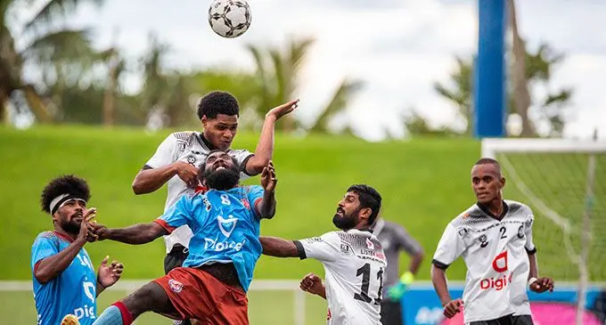 Nasinu midfielder Taniveke Tanabose (8) in an aerial battle against Suva in the Digicel Premier League clash at the ANZ Stadium, Suva, on March 13, 2022. Photo: Leon Lord.
