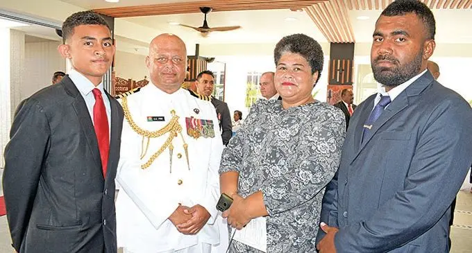Captain (navy) John Fox (second from left) with his family members William Fox, Akesa Fox and John Fox (jr) after receiving his  Officer of the Order of Fiji (OF) medal from the President, Major-General (Ret’d) Jioji Konrote, during the Order of Fiji Investiture Ceremony at the State House on November 29, 2019. Photo: Ronald Kumar