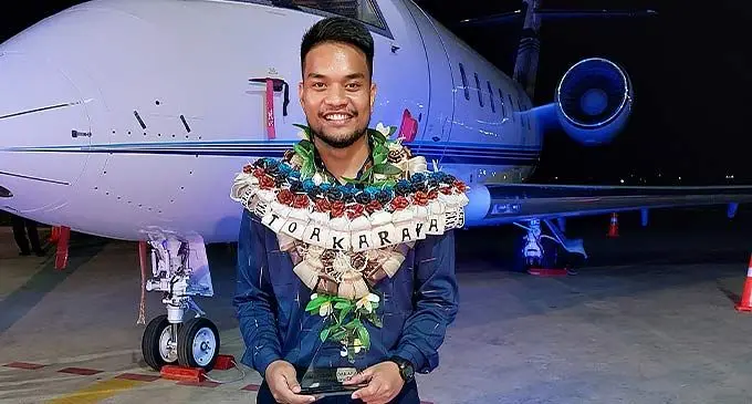 Mataroa Toakarawa with his award at the Pacific Flying School hangar in Nadi. Photo: Nicolette Chambers