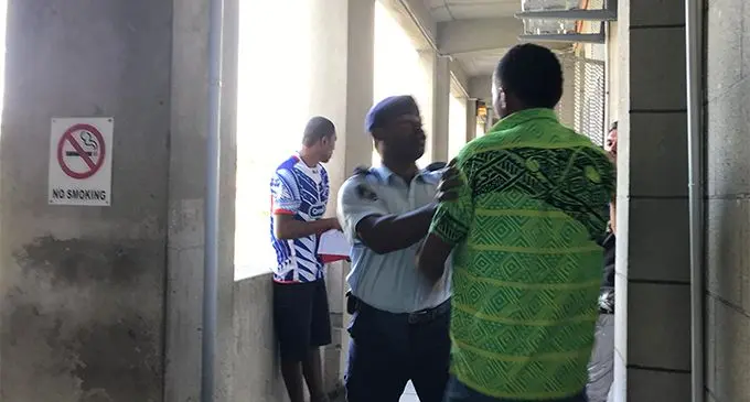 A Police escorting officer stopped a man from attacking murder accused Mosese Koroi at the Court premises on June 26, 2019. Photo: Ashna Kumar