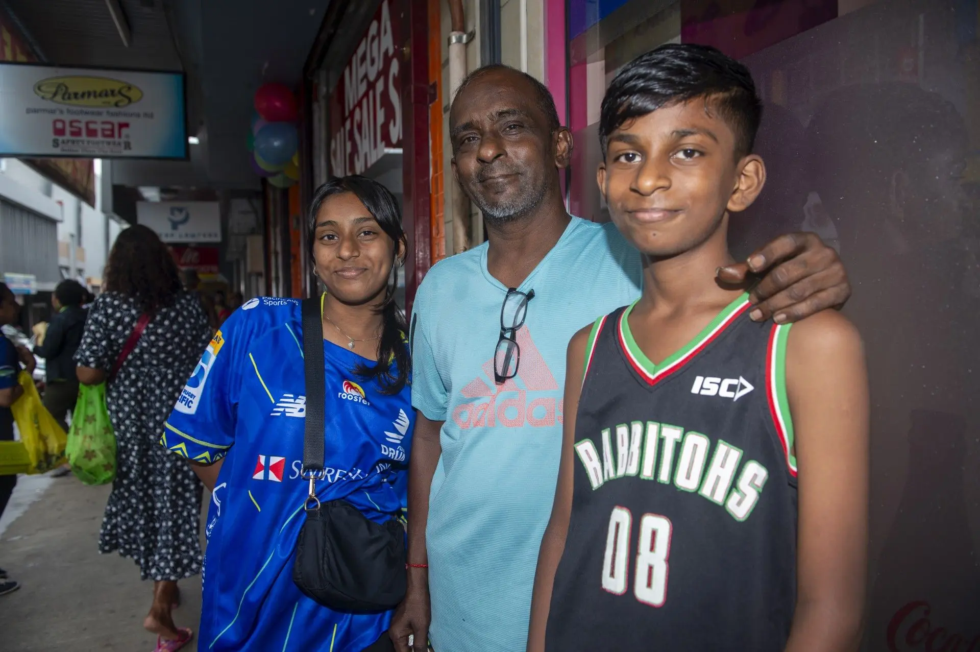 Mukesh Kumar (middle) with her two school children, Iskika Kumar (left) with Arush Kumar (right) during the  Back to School shopping on January 12, 2026.