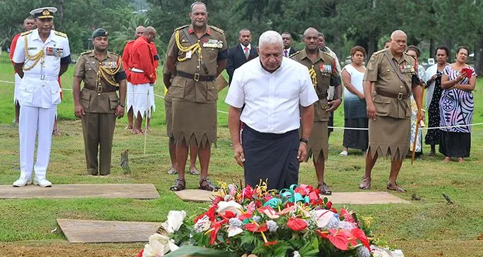 Prime Minister Voreqe Bainimarama pays his last respects to Lieutenant-Colonel Laisani Kinikini Vulakouvaki as Republic of Fiji Military Forces Commander Rear Admiral Viliame Naupoto, Land Force Commander Colonel Manoa Gadai and senior RFMF officers look on. Photo: RFMF Media Cell