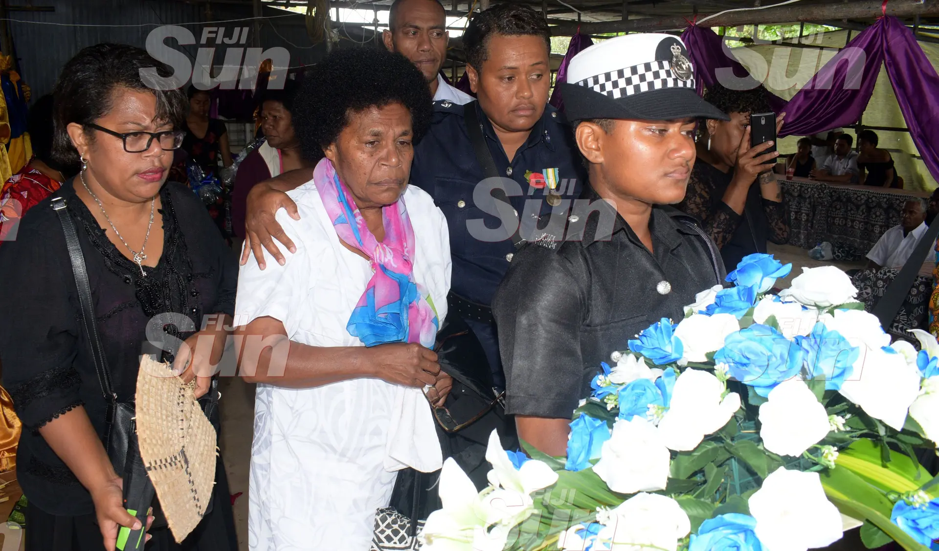 Late Constable Siuta Niumataiwalu’s Mother, Makereta Koroi 66 (second from left) is consoled by Inspector Mariana Bulatolu during the funeral service at Evergreen AOG Church in Nasinu on October 26, 2019. Photo: Ronald Kumar.