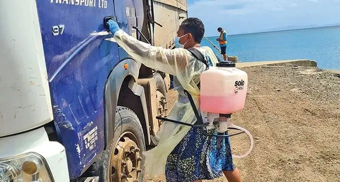 Finau Raikanikoda at work sanitising a truck. 