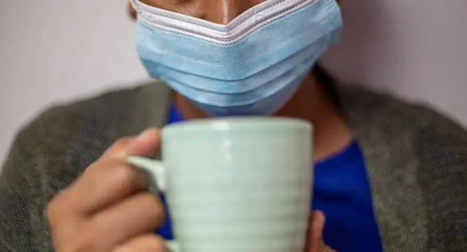 Wear a mask or face covering that covers your mouth and nose when in a public place. Photo: Leon Lord