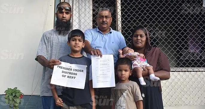 From left: Zainal Khan, Zayaan Khan (son), registered bailiff, Reggie Ali, Zohan Khan (son), Zaima Khan (wife of Zainal) with their one-month-old daughter, Zahraa Khan at their home at Alla Datta in Nadi. Photo: Mereleki Nai