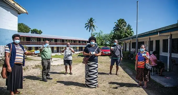 Parents of Basden College students (from left), Ateca Tuitoga, school principal Mohammed Saiyaz Khan, Laisenia Lomavatu, Marica Laite, Villiame Berwick and Sharon Morris receiving new smartphones from teachers for the students on August 4, 2021. Photo: Leon Lord