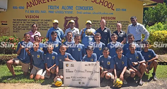 The students and teachers of Andrews Primary School with the Spot Go company owners, Brendan Small (last row, third from right), his wife, Nancy (last row, second from right) and head teacher, Dharmendra Reddy (last row, first from right) following the handover of sports gear in Nadi on March 15, 2022. Photos: Nicolette Chambers