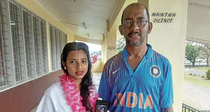Vivekta Chand (daughter) and Vivek Chand (husband) of cervical cancer survivor,  Rosylin Narayn.  Photo: Shreeya Verma