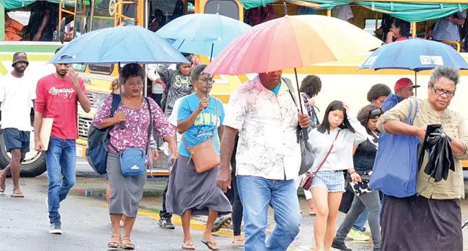 The rain came down and umbrellas went up ... many were seen prepared for continuous wet weather at the Suva Bus Stand on March 25, 2019. Photo: Ronald Kumar