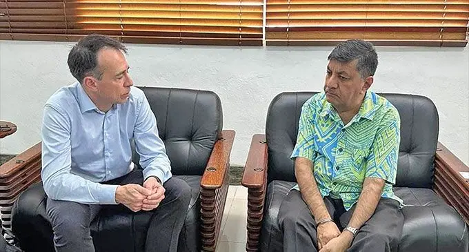 Czarnikow Company associate director, John Ireland, and Minister for Sugar, Charan Jeath Singh.