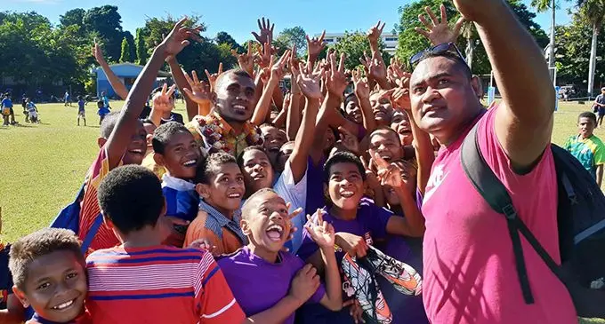 Fiji Airways Flying Fijian squad member Eroni Sau (with garland) with fans during the opening of the Kaji competion at Lautoka Central Primary School on June 8, 2019. Photo: Nicolette Chambers.