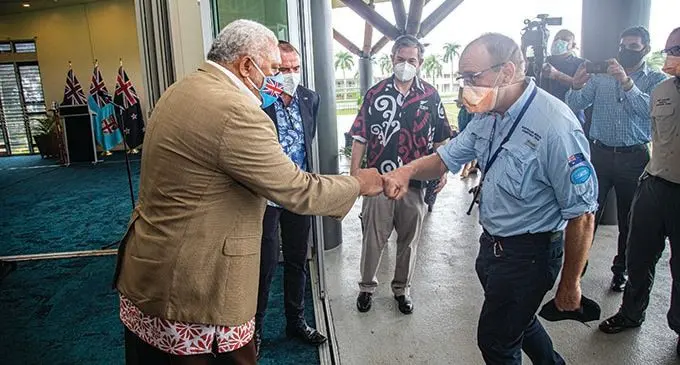 Prime Minister Voreqe Bainimarama thanks a member of the ANZMAT  medical team, Dr Brain Spain of Australia, at Albert Park in Suva on July 15, 2021. Dr Spain is part of the Alpha team that will be replaced by a Bravo team, which arrived on Wednesday night. Mr Bainimarama also bid goodbye and thanked the Alpha team for sacrificing their time and effort in helping Fijians during the COVID-19 crisis. Photo: Leon Lord