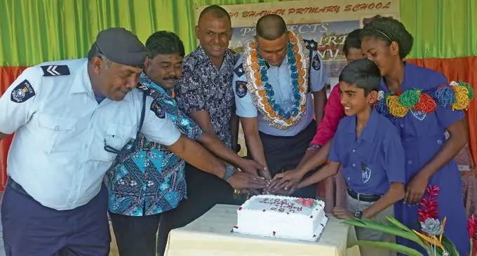 Divisional Police Commander West SSP Abdul Khan (centre), with headboy Krishal Raj, headgirl Rosalia Vakawale and the staff of Gandhi Bhawan Primary School on February 23, 2018. Photo: Karalaini Tavi