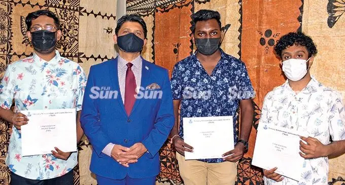 Tertiary Scholarship and Loans Service (TSLS) medical students who are grant recipients (from left), Anishil Kumar, Rihan Ali and Shifaz Ali with the acting Prime Minister and Attorney-General Aiyaz Sayed-Khaiyum at the FNU Pacifika Campus on February 16, 2022. Photo: Ronald Kumar