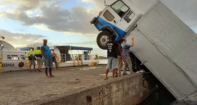 Garden Island Rootcrops Limited cargo truck partially submerged in the water at Backjetty in Taveuni. Photo: Fiji Roads Authority