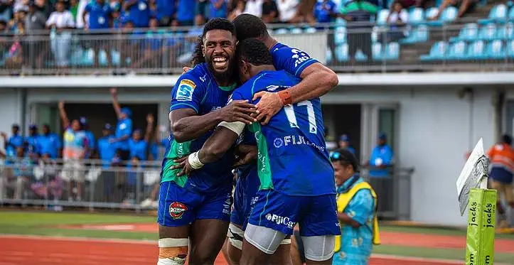 Frank Lomani {left) and Meli Derenalagi celebrate Taniela Rakuro's (11) second try against the Hurricanes last Saturday during round 11 of the Shop N Save Super Rugby Pacific. Swire Shipping Fijian Drua won 27-24 at Suva's HFC Bank Stadium. Photo: Leon Lord
