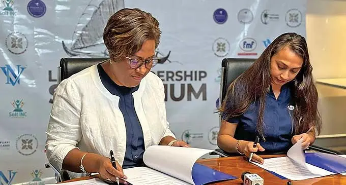 Ana Laqeretabua of Salt Inc Pte Ltd (left) with FMF's group marketing manager Maria Kumar during the golden sponsorship signing in Suva.