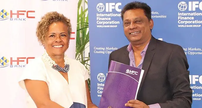 International Finance Corporation country manager for Australia, New Zealand, Papua New Guinea, and the Pacific Islands Judith Green and HFC Bank chief executive officer Rakesh Ram after the decision for a partnership by the organisations to support trade finance operations.