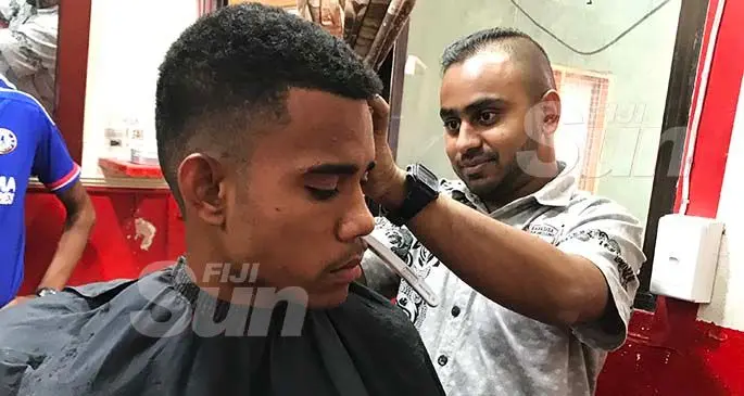 Iosefo Lenati gets a haircut at the Babasiga Hair Salon by barber Saad Ali on January 11, 2020. Photo: Laisa Lui.