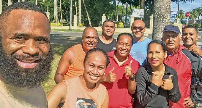 Flying Fijians centre Semi Radradra with Fiji Sun staff after their wellness programme at Albert Park on June 15, 2022. Back (from left) Peni Matasuka, Ilai Taka, Percy Kean and Jope Gaunavou. Middle row: Naisa Koroi, Sera Maiwakaya and Jane Tabutei. Front: Rayape Karavaki. Photo: Naisa Koroi