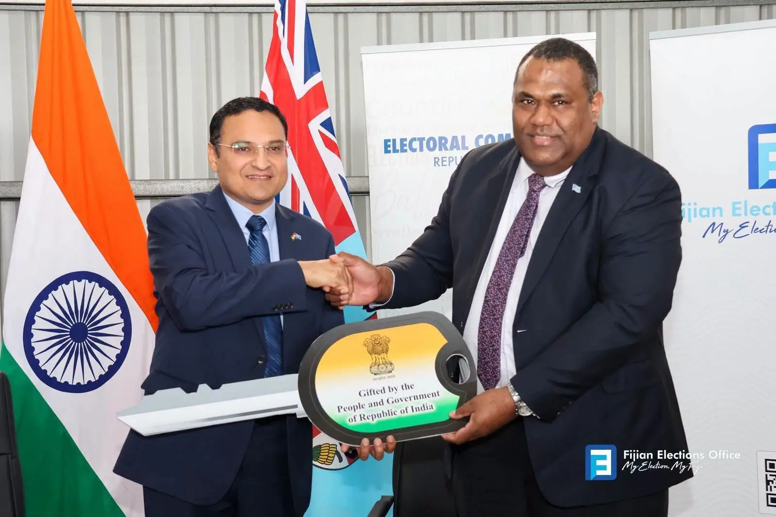His Excellency, High Commissioner of the Republic of India to Fiji Shri Suneet Mehta hands over the keys to chairperson of the Electoral Commission of Republic of Fiji, Justice Usaia Ratuvuli on August 7, 2026. Photo: FEO