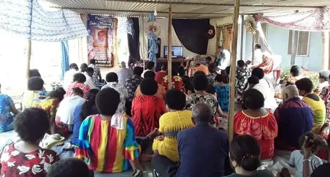 Family members and fellow mourners in Labasa view the livestream of the funeral of Pastor Saki Matana in New Zealand. Photo: Laisa Lui