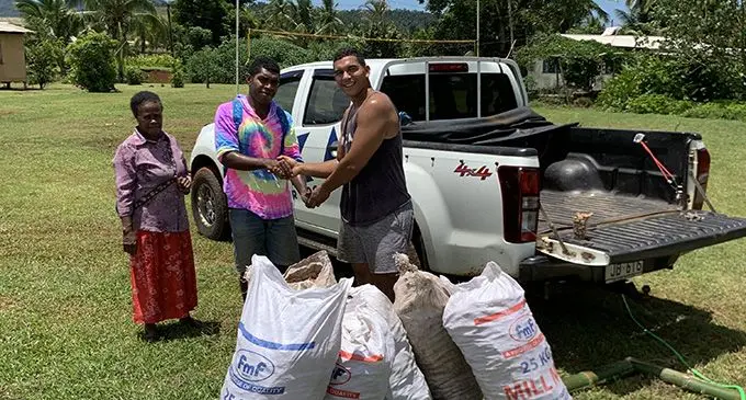 Jonathan Batisarisari buying turmeric in Vanua Levu. Inset: Fresh turmeric.