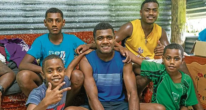 Siblings (front left) Petero Muavesi, Suliano Komai (back left), Iowane Savenaca (middle), Lorosio Civoniceva (back right) Samuela Kava (front right) are proud of their brother at their home in Nadera on the 16th January 2021. Photo: Leon Lord