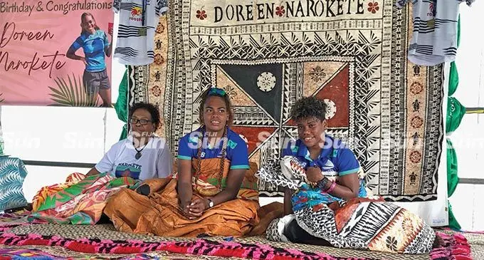 Rooster Chicken Fijiana Drua players, Doreen Narokete (second from left) and Vitalina Naikore (right) during their joint celebration at Milverton Road, Raiwaqa, on May 13, 2022. They were accorded a traditional welcome ceremony and church service hosted by the Narokete family. Photo: Sereana Salalo