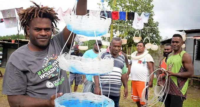 Tevita Koinui, 30 (left) , with other residents of Waivokai Settlement in Lami, who were laid off work from a fishing company found an alternative way of earning money.   Photo: Ronald Kumar