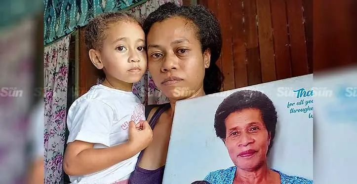 Merelita Nawaqasena, daughter Diana with a photo of her late mother and grandmother, Mere Salu, at their home in Tamavua Village on August 10, 2023. Photo: Ronald Kumar