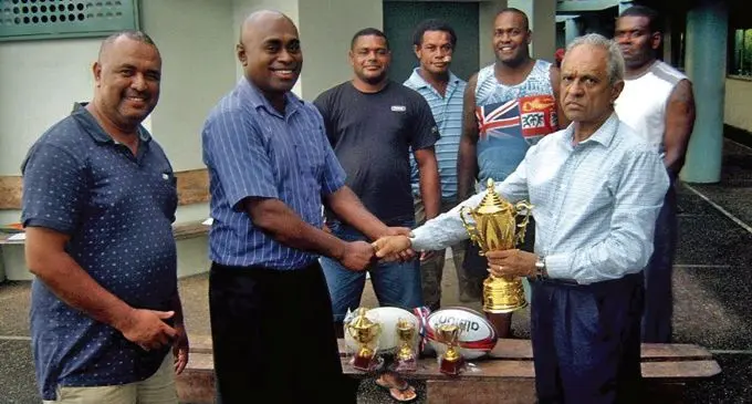 From left; Ba Rugby Union secretary Solomone Vakanawa, president Napolioni Noco and Mahendra Bilimoria handing over the trophy in Ba on February 21,2018. Photo: Ba Rugby