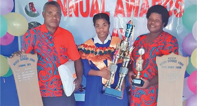 Parents of Alisi Soso (middle), Neil Armstrong and Kelera Adisovasiga  celebrate her achievement as the Dux of Duavata Secondary School in  Macuata on December 2, 2020. Photo: Duavata Secondary School