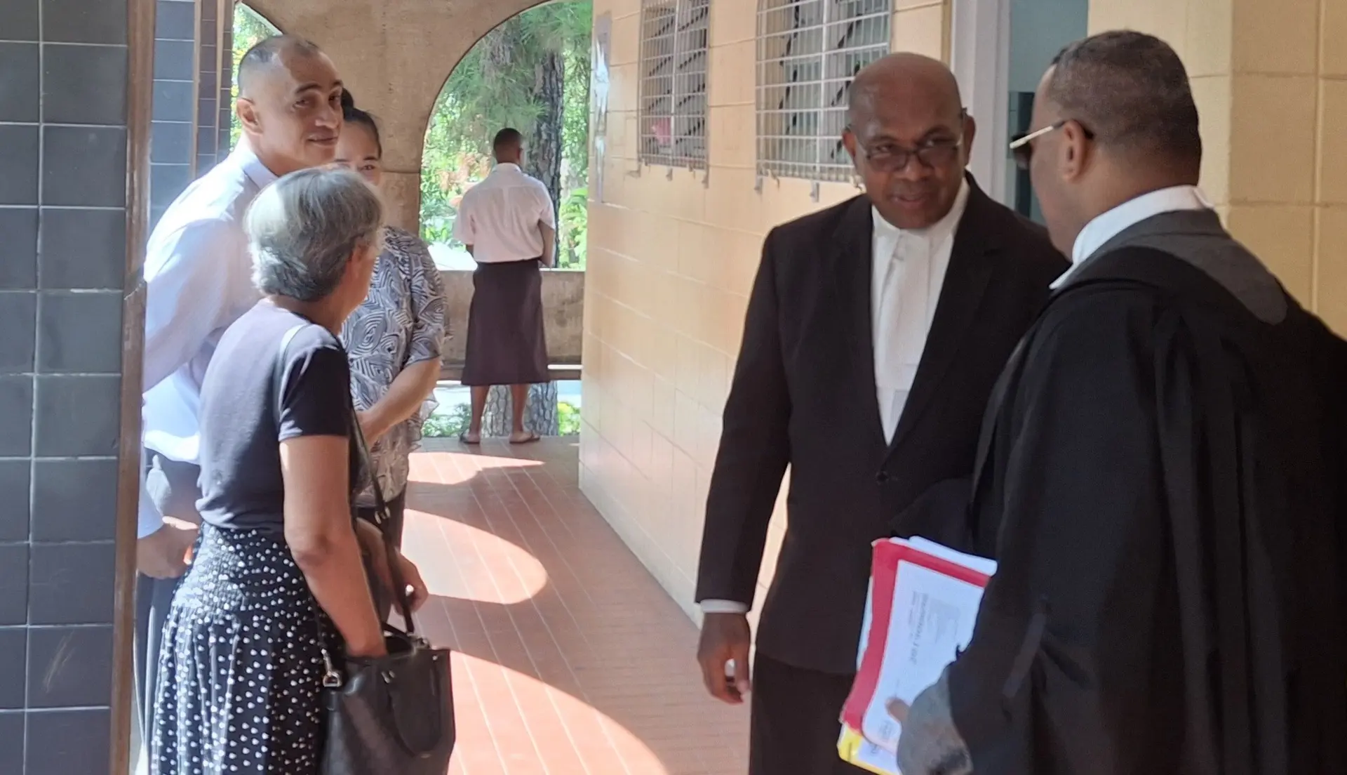 Accused Fredrick Epeli with family members (right) and left are the two lawyers, Aca Rayawa and John Rabuku outside the High Court in Lautoka.