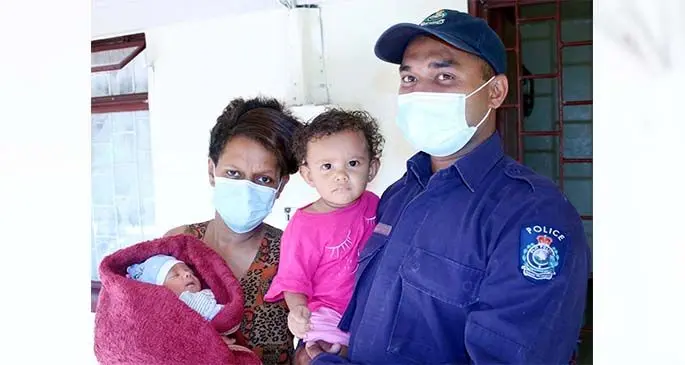Police Constable Savenaca Joape and his wife Talica Baleikumi, with their daughter Grace Faith Vinakaidakuna (pink shirt) and their newborn son, Manasa Koroivere . Photo: Fiji Police Force