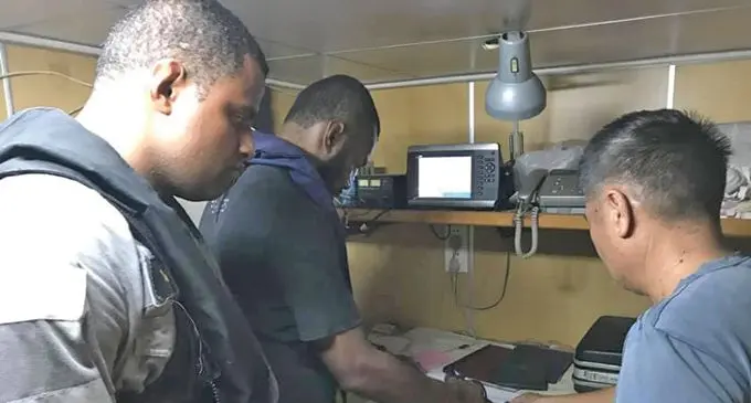 Officers on board RFNS Kula entering information