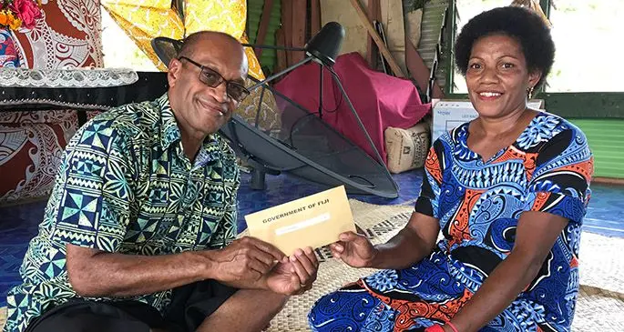 From left: Minister for Infrastructure and Meteorological Services, Land and Mineral Resources Jone Usamate with Laisa Sayawa, a recipient of the Serau clan at Nabiti Village on June 12,2020. Photo: Laisa Lui
