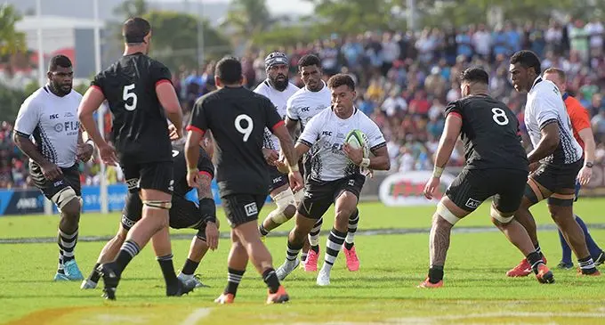 Fiji Airways Flying Fijians rep Ben Volavola (with ball) on the attack against the Maori All Blacks during the Pacific Test Series at Suva’s ANZ Stadium on July 13, 2019. In support (from left) are Albert Tuisue, Captain Dominiko Waqaniburotu and Frank Lomani. Fiji won 27-10. The Flying Fijians leave today for Rotorua, New Zealand,  their second test match against the Maori All Blacks.  Photo: Ronald Kumar