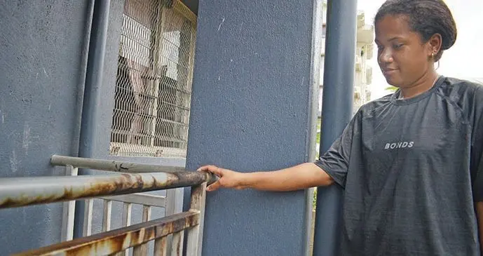 Esita Marama shows the burned railing outside her Public Rental Board Raiwai flat on September 25, 2019.  Photo: Ronald Kumar