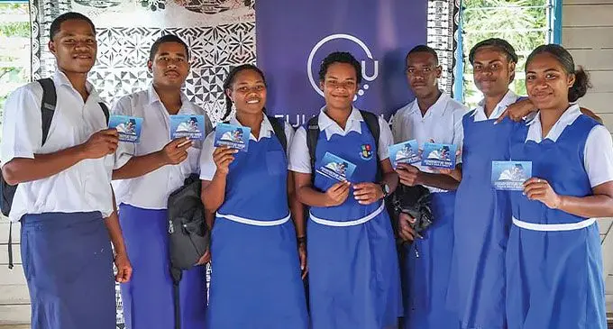 Karo High School students with the Fiji National University's 2025 Prospectus. Photo: FNU