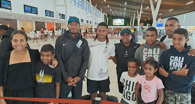 Fiji Airways Fijian men’s sevens players (from left) Ioane Teba, Manueli Maisamoa, Waisea Nacuqu (captain), Tira Welagi with fans at Nadi International Airport on October 30, 2022. Photo: Waisea Nasokia