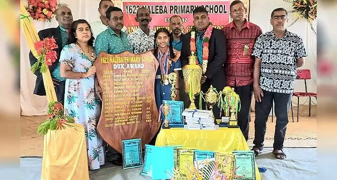 Naleba Primary School dux Shavleen Raj with her parents, teachers and invited guests during the annual prizegiving ceremony in Labasa on December 6, 2022.